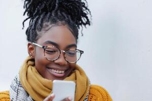 AI generated Young Woman in Glasses and Mustard Scarf Smiling at Smartphone Message photo