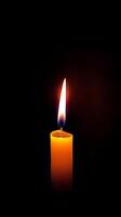 AI generated Solitary Candle Flame In Darkness photo