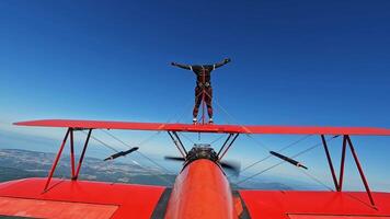 Man on airplane in flight extreme sport video