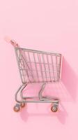 AI generated Toy supermarket grocery push cart with wheels on pink background Vertical Mobile Wallpaper photo