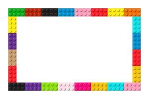 Color frame composed of coloured plastic toy blocks. Colorful brick banner. Abstract vector background