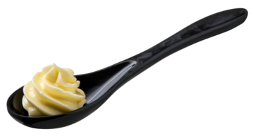 AI generated Creamy dollop of yellow butter on a black spoon on transparent background - stock png. png