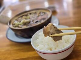 Buk Kut Teh, a Chinese pork soup dish, eat with rice and some vegetable, normally found in Southeast Asia. photo