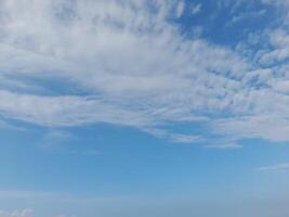 The white clouds on the blue sky are perfect for the background. Skyscape on Lombok Island, Indonesia photo