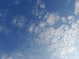 The white clouds on the blue sky are perfect for the background. Skyscape on Lombok Island, Indonesia photo