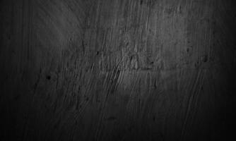 Black concrete texture as a concept of horror and Halloween. Dark wall background cement or stone. photo