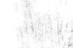 Abstract dusty and grungy scratch texture material or surface. The particles of charcoal splatted on white background. black dust particles explode isolated on white background photo