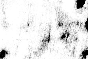 Abstract dusty and grungy scratch texture material or surface. The particles of charcoal splatted on white background. black dust particles explode isolated on white background photo