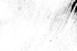Abstract dusty and grungy scratch texture material or surface. The particles of charcoal splatted on white background. black dust particles explode isolated on white background photo