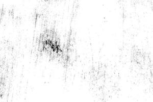 Abstract dusty and grungy scratch texture material or surface. The particles of charcoal splatted on white background. black dust particles explode isolated on white background photo