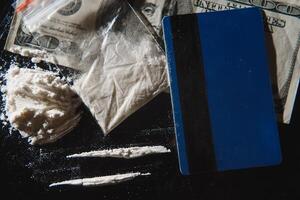 Hard drugs on black table. Close up. photo