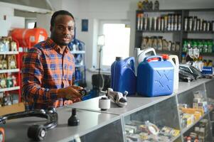 Smiling african Salesman Auto Parts Store photo