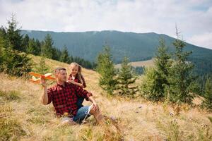 Happy father and little child are walking in the mountains. Father's Day. vacation in the national park. photo