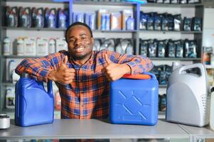 Portrait of a handsome salesman in an auto parts store. The concept of car repair photo