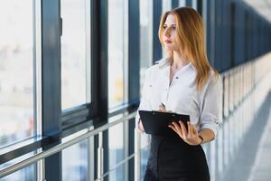 Modern business woman in the office with copy space photo