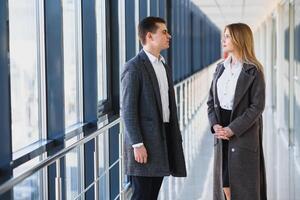 The business people walk in the office hall photo