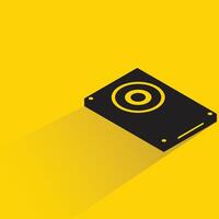 computer hard disk with shadow on yellow background vector