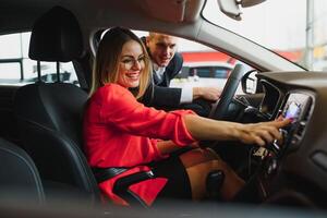 indian dealer explaining car features to potential customer photo