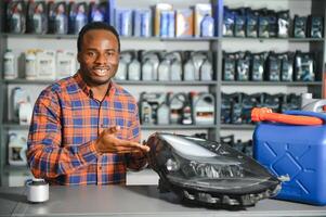 Smiling african Salesman Auto Parts Store photo