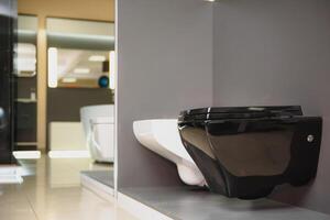 samples of modern sanitary ware for the toilet. new modern toilet in the plumbing store photo