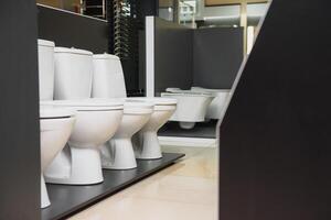 samples of modern sanitary ware for the toilet. new modern toilet in the plumbing store photo