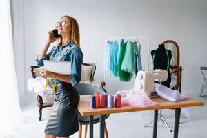 Fashion designer working in the studio. photo