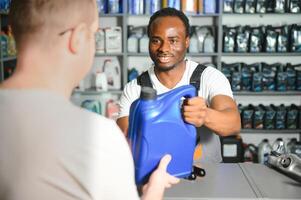 A customer is talking to a salesperson at an auto parts store photo