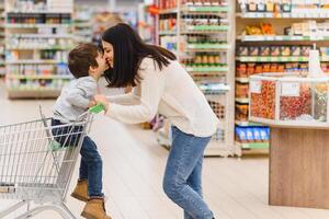 Mother with son at a grocery store photo