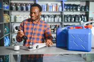 Smiling african Salesman Auto Parts Store photo