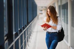 Smiling female student enhancing her future by attending regular lectures photo