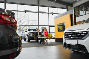 Woman buying the car and seller selling photo