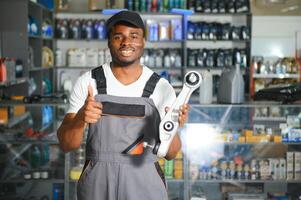 Smiling african Salesman Auto Parts Store photo