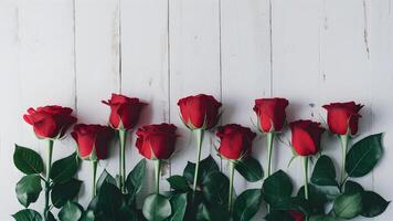 ai generado elegante frontera de pocos rojo rosas en contra prístino blanco fondo foto