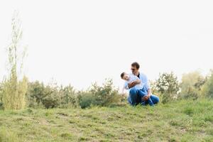 Happy time with father. Family fun concept. Bearded man and cute son Kids smile. Spring time walk with father. photo