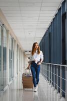 Pretty young female passenger at the airport photo