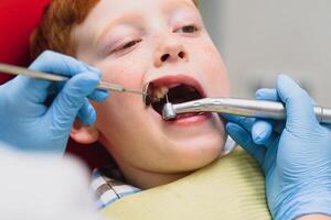 Boy satisfied with the service in the dental office. concept of pediatric dental treatment photo