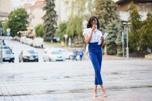 A shot of a beautiful black businesswoman outdoor photo