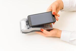 paying through smartphone using NFC technology. payment by phone through the terminal photo