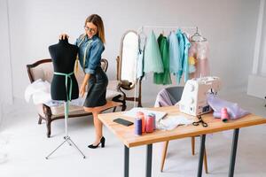 Fashion designer working on her designs in the studio photo