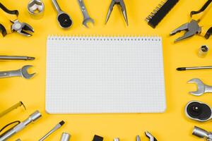 Set of various construction tools. Tools for home repair. Work at a construction site. On a yellow background. Flatly. Flatlay photo