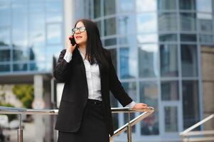 Young business woman portrait near office building photo