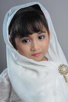 A Young Asian girl wearing Javanese Traditional Clothes photo