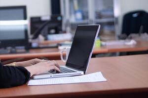 hands typing on a computer keyboard photo