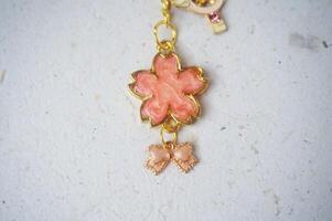a closeup shot of a beautiful flower shaped necklace photo