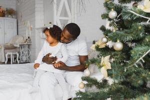 happy multiracial family with gifts at Christmas photo