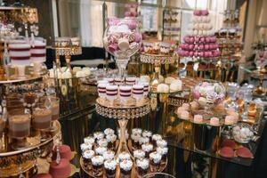 Delicious wedding reception candy bar dessert table. macaroon on candy bar, candy bar on holiday, candy bar at the wedding. photo