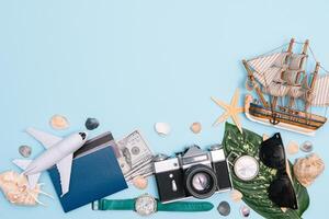 Travel accessories on blue background, travel concept. Top view with copy space photo
