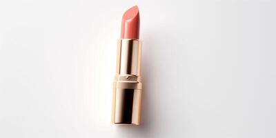 AI generated An peach fuzz color lipstick in a golden case on a white background. Make up a product photo shoot. Copy space.
