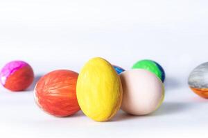 Colorful easter eggs on white background with copy space for text. photo