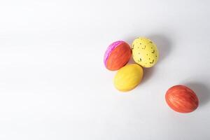 Colorful easter eggs on a white background with copy space for text. photo